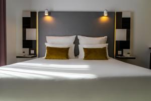 Postel nebo postele na pokoji v ubytování Hotel Valentina