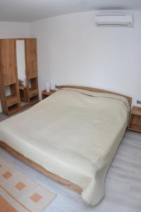 Postel nebo postele na pokoji v ubytování Fűzliget Ezüstnyár