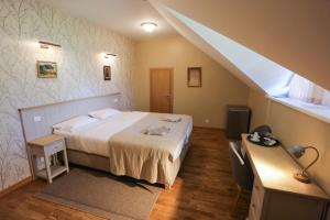 Postel nebo postele na pokoji v ubytování Hotel Jonapolis