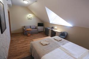 Postel nebo postele na pokoji v ubytování Hotel Jonapolis