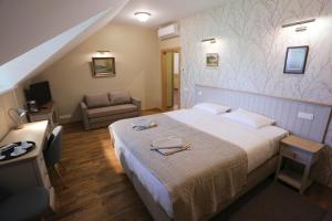 Postel nebo postele na pokoji v ubytování Hotel Jonapolis