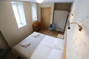 Postel nebo postele na pokoji v ubytování Hotel Jonapolis