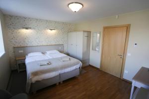 Postel nebo postele na pokoji v ubytování Hotel Jonapolis