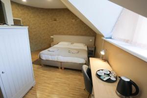 Postel nebo postele na pokoji v ubytování Hotel Jonapolis