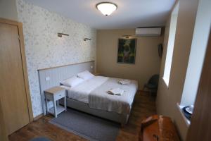Postel nebo postele na pokoji v ubytování Hotel Jonapolis