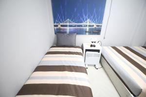 24Guesthouse Seomyeon tesisinde bir odada yatak veya yataklar