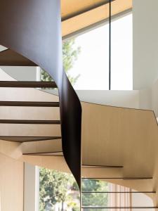 a spiral staircase in a house with a window at Criu Boutique Hotel in Nicolosi