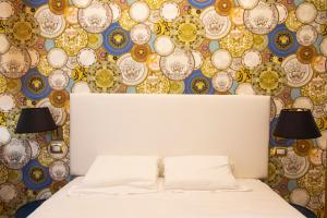 A bed or beds in a room at Hotel Cinquantatre