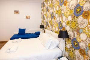 A bed or beds in a room at Hotel Cinquantatre