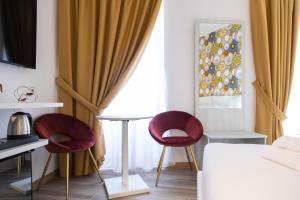 A bed or beds in a room at Hotel Cinquantatre