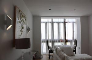 a living room with a couch and a table at PLAZA CABILDO 4 in Sanlúcar de Barrameda