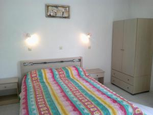 Postel nebo postele na pokoji v ubytování Vassilis Studios