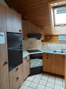 a small kitchen with a sink and a stove at good bed Niederbipp 13 in Niederbipp