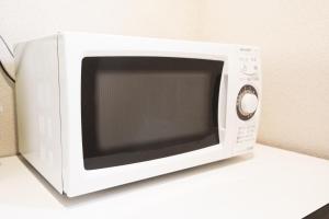 TV a/nebo společenská místnost v ubytování Toyooka Sky Hotel