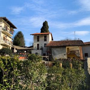 a view of a house and a building at Locanda Vecchio Cipresso in Chiaverano