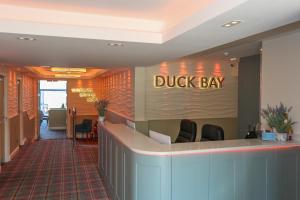 a dudley bay sign on the wall of a lobby at Duck Bay Hotel & Restaurant in Balloch