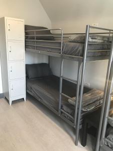 a room with two bunk beds and a closet at THE LORD GREY HOTEL in Boston