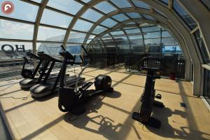 a gym with several exercise bikes in a building at Ferretti MajesticHouse in Castenedolo