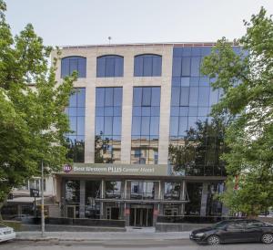 a large building with a clock on the front of it at Best Western Plus Center Hotel in Ankara