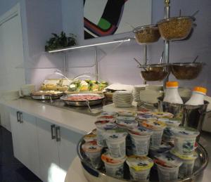 a buffet with some food on a table at Aurea Hotel in Tortoreto Lido