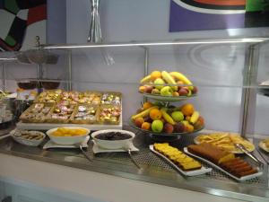 a buffet line with many different types of food at Aurea Hotel in Tortoreto Lido