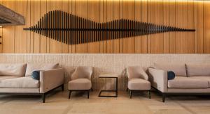 a lobby with three chairs and a heart on the wall at Poseidon The Beach Hotel in Budva