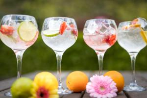 four wine glasses with fruit in them on a table at Ardboyne Hotel in Navan