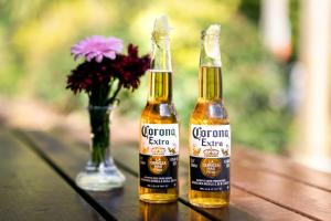 two bottles of corona beer and a vase with flowers at Ardboyne Hotel in Navan