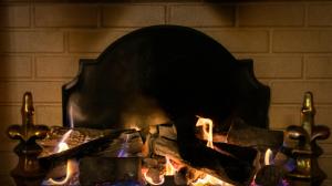 a fire is burning in a large fireplace at Ardboyne Hotel in Navan