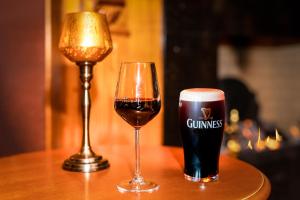 two glasses of beer sitting on a table at Ardboyne Hotel in Navan