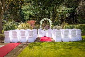 a row of white chairs on a red carpet at Ardboyne Hotel in Navan