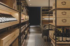 a wine cellar with bottles of wine on shelves at Locanda Appennino in Predappio