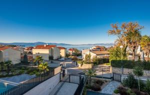 a view of a city from the balcony of a house at Luxury Villa Ane in Malinska