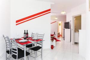 a dining room and kitchen with a table and chairs at Apartments Pojko in Dubrovnik