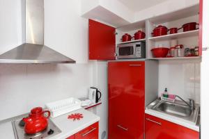 Kuchyňa alebo kuchynka v ubytovaní Apartments Pojko
