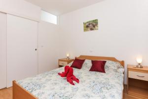 Posteľ alebo postele v izbe v ubytovaní Apartments Pojko