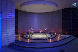 a bathtub with lights in a room with at Crowne Plaza Newcastle - Stephenson Quarter, an IHG Hotel in Newcastle upon Tyne