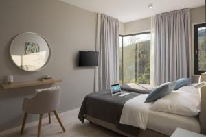 a bedroom with a bed with a laptop on it at Villa Selene in Rabac +16 photos