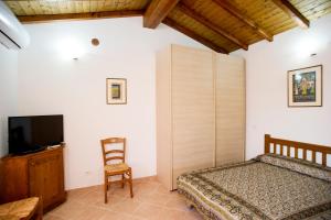 A bed or beds in a room at Residenza Le Tartarughe
