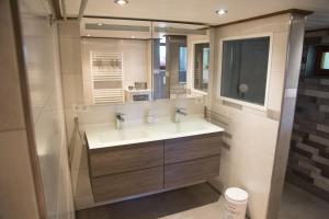 a bathroom with a sink and a mirror at Zur alten Oele - Hochwertig und Familienfreundlich in Lenzkirch +17 photos