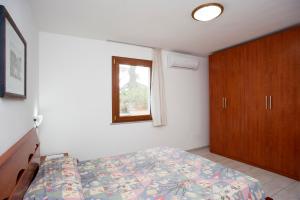 A bed or beds in a room at Residenza Le Tartarughe
