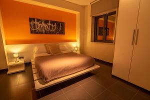 Łóżko lub łóżka w pokoju w obiekcie Hotel Los Nardos