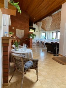 a dining room with a table and chairs at Reiumaa Motell in Reiu