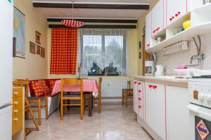 a kitchen and dining room with a table and chairs at Pension u Josefa in Košťálov