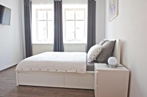 Postel nebo postele na pokoji v ubytování R&J apartmány