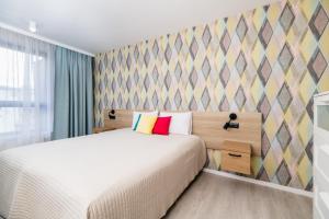 Posteľ alebo postele v izbe v ubytovaní Apartamenty nad Wisłą