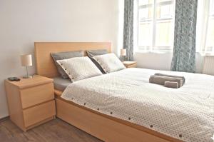 Postel nebo postele na pokoji v ubytování R&J apartmány