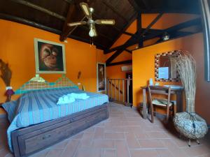 A bed or beds in a room at La Fattoria Delle Tartarughe