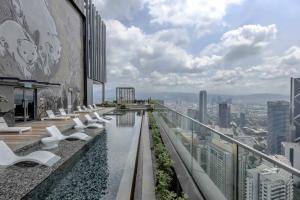 a view from the rooftop of a building with a swimming pool at Art Apartments KL in Kuala Lumpur