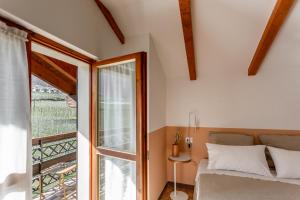 Säng eller sängar i ett rum på Ca' Marchesi apartments